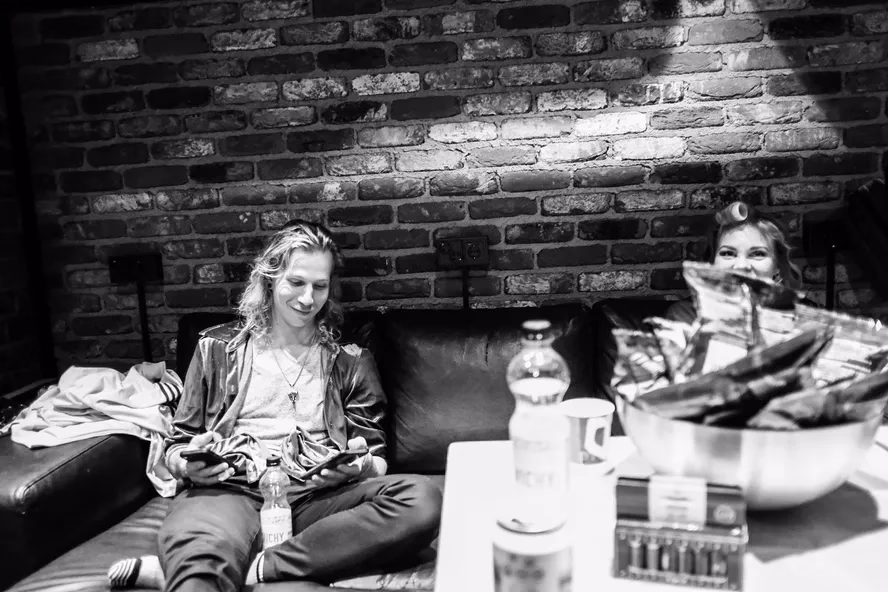 Drummer and singer hanging in the backstage.