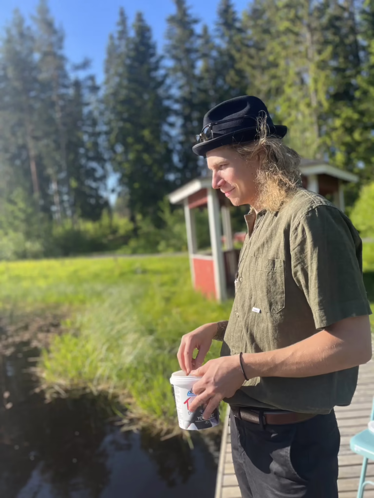 Man in the nature feeding the fish.